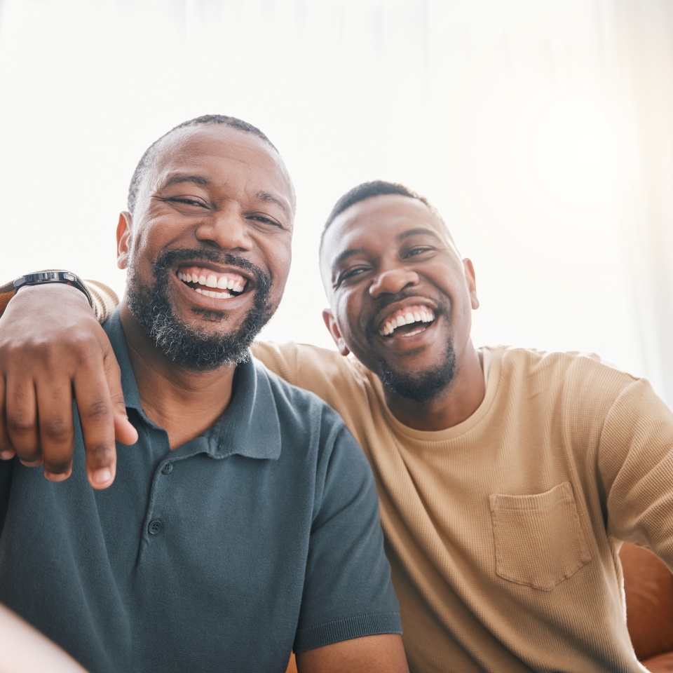Happy black man, friends and selfie in photography, bonding or friendship together on sofa at home. Portrait of African male person smile for picture, photo or memory in social media or vlog in house