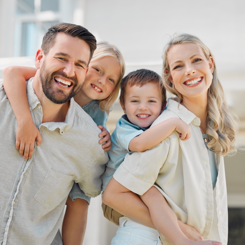 Parents, piggyback and children outdoor in portrait for love, bonding and playful interaction of support at house. Smile, woman and man with kids for family activity in backyard for memory at home